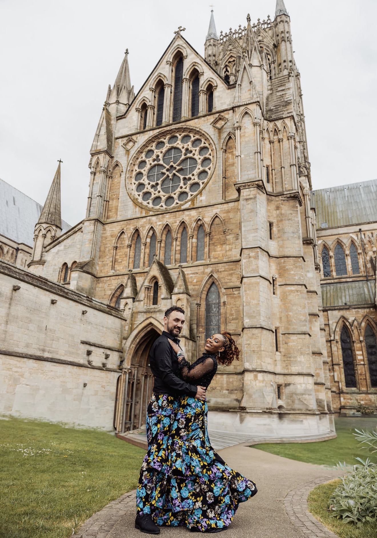 Two cultures, one love: Gabriella and Elliott pose together outside a historic church. Photograph: Thomasxphotography