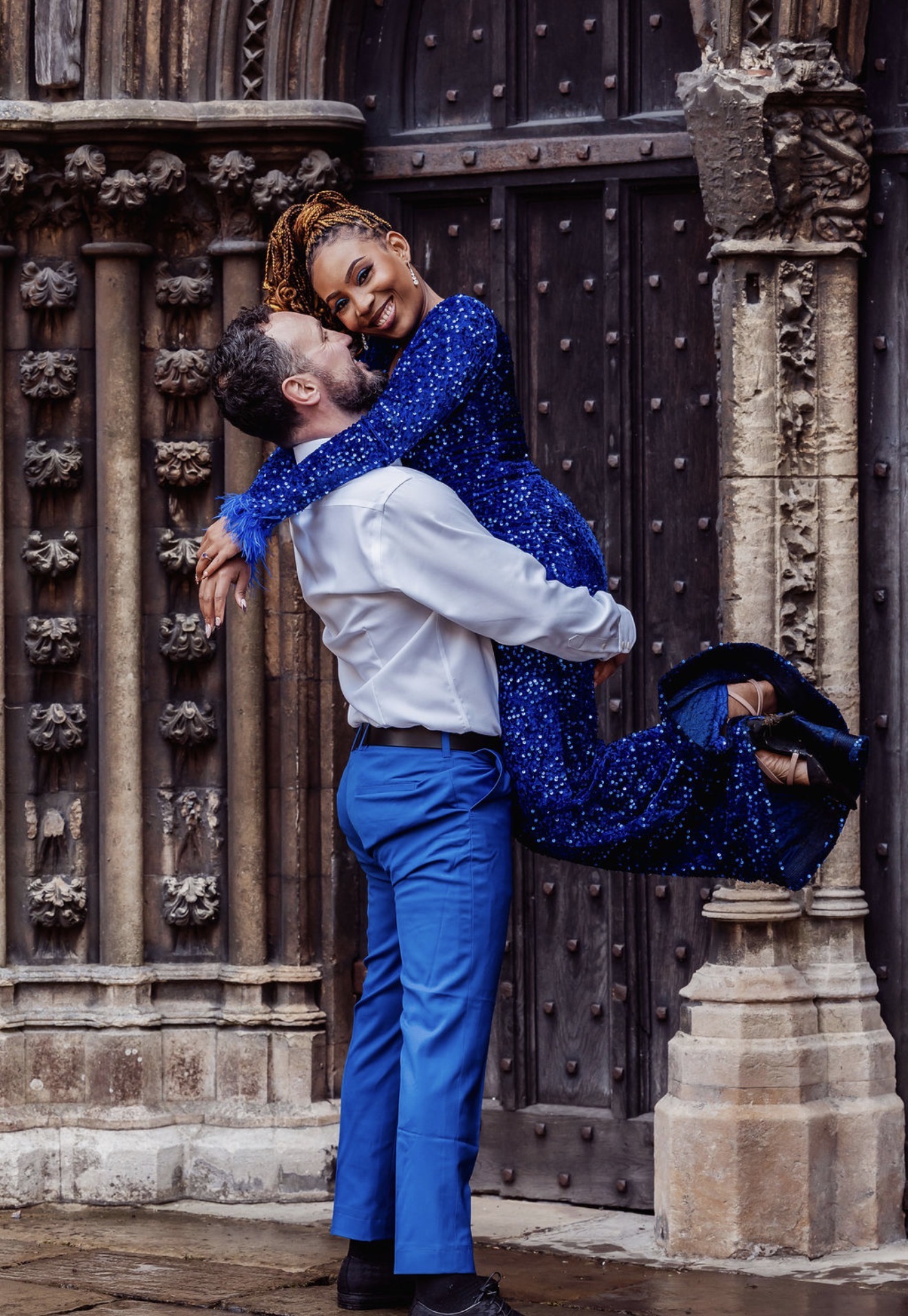 Elliott lifts Gabriella in a playful embrace. Photograph: Thomasxphotography